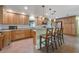 Well-appointed kitchen with stainless steel appliances and a center island with barstool seating at 21551 Lake Seneca Rd, Eustis, FL 32736