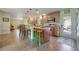 Functional kitchen featuring bar seating, updated appliances, and backyard access at 21551 Lake Seneca Rd, Eustis, FL 32736
