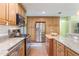Modern kitchen featuring stainless steel appliances, granite countertops, and center island at 21551 Lake Seneca Rd, Eustis, FL 32736