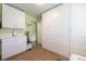 This laundry room features cabinets, drawers, and tile floors at 21551 Lake Seneca Rd, Eustis, FL 32736