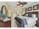 Beautiful bedroom with a ceiling fan and natural light, creating a serene atmosphere at 5935 Tivoli Gardens Blvd, Orlando, FL 32829
