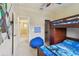 This bedroom features a bunk bed, star wars accents, and neutral paint at 5935 Tivoli Gardens Blvd, Orlando, FL 32829