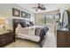Relaxing bedroom features a ceiling fan and natural light, perfect for unwinding at 5935 Tivoli Gardens Blvd, Orlando, FL 32829