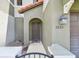 Inviting townhome entrance with stylish front door, exterior light, and well-kept exterior at 5935 Tivoli Gardens Blvd, Orlando, FL 32829