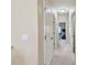 Bright hallway with multiple doors, offering access to different areas of the home at 5935 Tivoli Gardens Blvd, Orlando, FL 32829