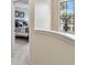 Well-lit hallway with carpet flooring that leads to a bedroom at 5935 Tivoli Gardens Blvd, Orlando, FL 32829