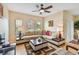 Bright living room boasts neutral walls, stylish furniture, and large windows at 5935 Tivoli Gardens Blvd, Orlando, FL 32829