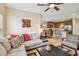 Inviting living room open to the kitchen features comfortable seating and hardwood flooring at 5935 Tivoli Gardens Blvd, Orlando, FL 32829