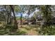 Wide backyard with shed, pool area and wooded landscape for a serene outdoor space at 1625 Itchepackesassa Dr, Lakeland, FL 33810