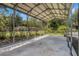 Open carport structure with a concrete floor and a view of the backyard at 1625 Itchepackesassa Dr, Lakeland, FL 33810