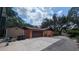 Spacious driveway leading to a two-car garage and exterior home view at 1625 Itchepackesassa Dr, Lakeland, FL 33810