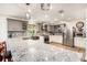 Well-appointed kitchen with stainless appliances, granite counters, and mosaic backsplash, exuding style and functionality at 1625 Itchepackesassa Dr, Lakeland, FL 33810