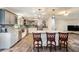 Modern kitchen with granite countertops, stainless steel appliances, and convenient seating at the island at 1625 Itchepackesassa Dr, Lakeland, FL 33810