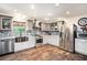 Updated kitchen boasts stainless steel appliances, gray cabinets and mosaic tile backsplash at 1625 Itchepackesassa Dr, Lakeland, FL 33810
