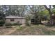Backyard shed providing extra storage space with mature landscaping at 1625 Itchepackesassa Dr, Lakeland, FL 33810