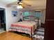 Bedroom featuring a patterned comforter, hardwood floors, and a closet at 606 Lakespur Ln, Altamonte Springs, FL 32714