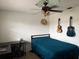 Bedroom with a guitar and a sombrero at 606 Lakespur Ln, Altamonte Springs, FL 32714