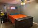Bedroom featuring an orange comforter, ceiling fan, and wood dresser at 606 Lakespur Ln, Altamonte Springs, FL 32714