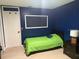 Bedroom featuring a green comforter, a modern lamp, and tile floors at 606 Lakespur Ln, Altamonte Springs, FL 32714