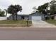 Charming single-story home featuring a two-car garage and mature landscaping at 606 Lakespur Ln, Altamonte Springs, FL 32714