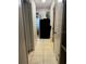 Hallway with tile floors and a plant at the end of the hall at 606 Lakespur Ln, Altamonte Springs, FL 32714