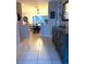 Hallway featuring tiled floors and view to the dining room at 606 Lakespur Ln, Altamonte Springs, FL 32714
