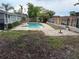 Backyard pool area showcasing the pool, patio, and wooden fencing at 606 Lakespur Ln, Altamonte Springs, FL 32714