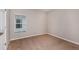 Clean bedroom with neutral walls, carpeted floors, and a window offering natural light at 729 Ambleside Dr, Haines City, FL 33844