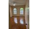 Bedroom featuring beautiful wood flooring, ceiling fan, and dual windows at 2202 Garden Lake Dr, Winter Haven, FL 33884