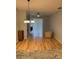 Spacious living room with hardwood floors and sliding glass doors provides ample natural light at 2202 Garden Lake Dr, Winter Haven, FL 33884