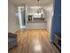 Open-concept living space with hardwood floors and kitchen views, perfect for entertaining at 2202 Garden Lake Dr, Winter Haven, FL 33884