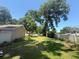 Spacious backyard with lush green grass and a privacy fence, perfect for outdoor activities at 2921 Se 38 Pl, Ocala, FL 34480