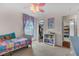 This bedroom boasts a colorful bed, closet, and doorway to another bedroom at 2921 Se 38 Pl, Ocala, FL 34480