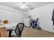 Bright bedroom with a plush carpet, comfortable single bed, dresser, and storage shelves at 2921 Se 38 Pl, Ocala, FL 34480