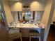 Counter featuring refreshments and a pass-through window to the kitchen and dining areas at 2921 Se 38 Pl, Ocala, FL 34480