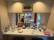 Counter featuring refreshments and a pass-through window to the kitchen and dining areas at 2921 Se 38 Pl, Ocala, FL 34480