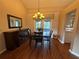 Bright dining room featuring a chandelier and access to the outdoors at 2921 Se 38 Pl, Ocala, FL 34480