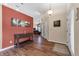 Inviting entryway with wood floors, accent wall, and seamless flow into the living spaces at 2921 Se 38 Pl, Ocala, FL 34480