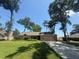 Charming single story home with manicured lawn and mature trees at 2921 Se 38 Pl, Ocala, FL 34480