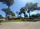 Charming single-story home with a manicured lawn, mature trees, and a two-car garage at 2921 Se 38 Pl, Ocala, FL 34480