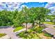 Beautiful home framed by mature trees, featuring a well-manicured lawn and outlined property at 2921 Se 38 Pl, Ocala, FL 34480