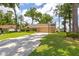 Well-maintained front yard with lush grass and a long driveway leading to the garage at 2921 Se 38 Pl, Ocala, FL 34480