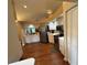 Bright kitchen featuring white cabinets, stainless steel appliances, and wood-look floors at 2921 Se 38 Pl, Ocala, FL 34480