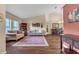 Open living space with vaulted ceilings, wood floors, and a cozy, inviting atmosphere at 2921 Se 38 Pl, Ocala, FL 34480