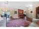 Bright and airy living space featuring wood floors, comfortable seating, and a connected dining area at 2921 Se 38 Pl, Ocala, FL 34480