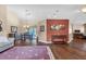Spacious living area with wood flooring, open layout, and access to the dining area and beyond at 2921 Se 38 Pl, Ocala, FL 34480
