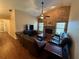 Inviting living room with a brick fireplace, wood floors, and comfortable leather furniture at 2921 Se 38 Pl, Ocala, FL 34480