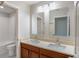 Bathroom showcasing a double vanity, quartz countertop, and decorative mirrors above at 383 Blue Lake Cir, Kissimmee, FL 34758