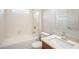 Bathroom featuring a white bathtub, a single vanity, and a neutral color scheme at 383 Blue Lake Cir, Kissimmee, FL 34758