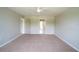 Spacious bedroom with neutral carpet and ample natural light at 383 Blue Lake Cir, Kissimmee, FL 34758